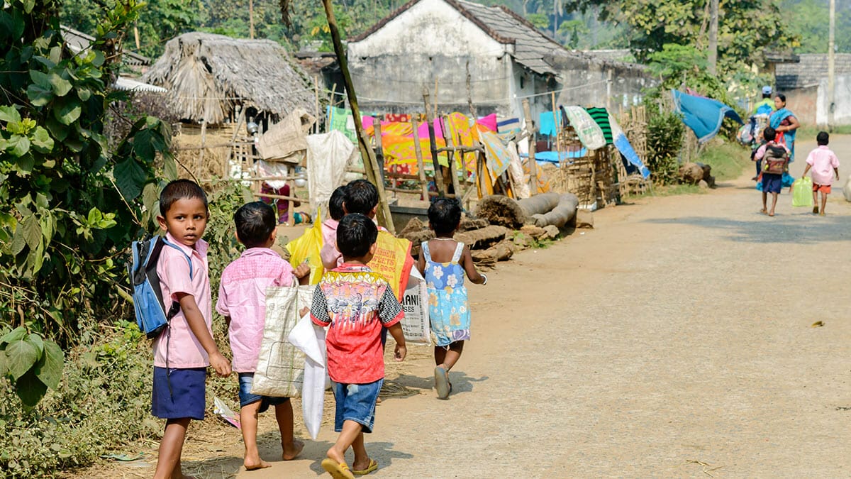 Schoolkids Angul Odisha India School children walking in a village after school in Angul district of Odisha state in india. Image: Abhishek Bagrodia / Shutterstock.com